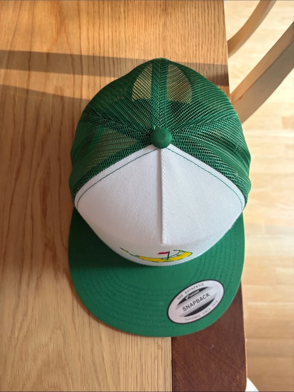 The Classic White and Green Trucker Hat with Nantucket masters Graphic